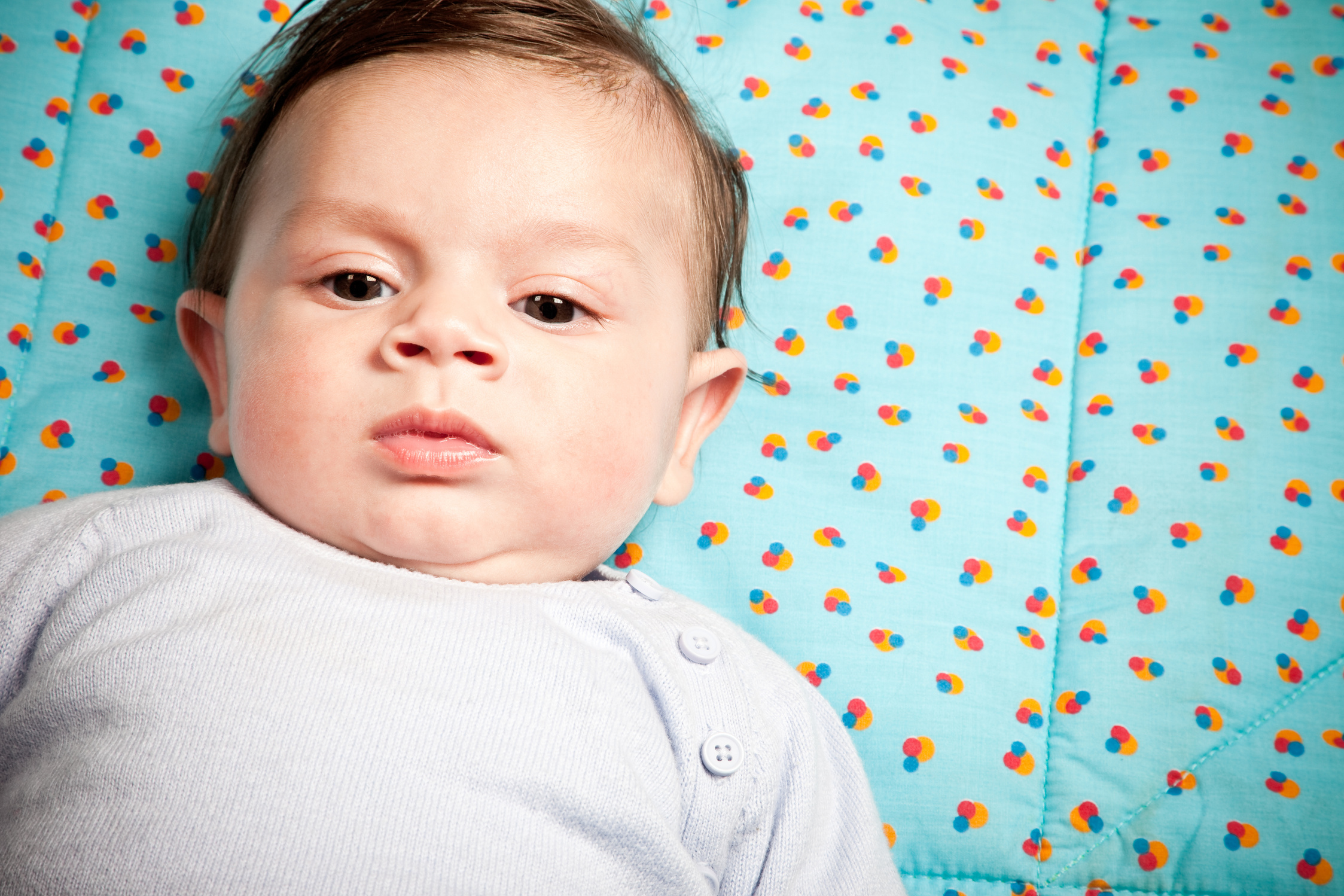 4 Months Baby Lying On The Quilt