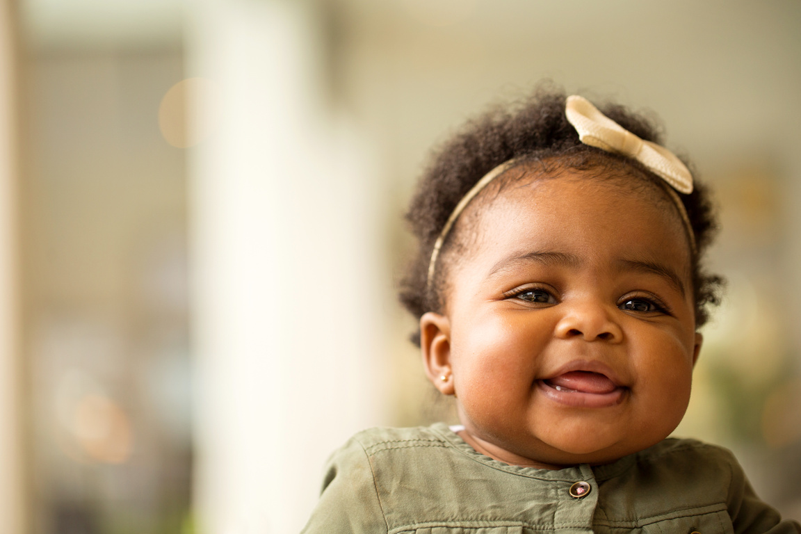 Portrait of a Happy Little Girl Laughing and Smiling